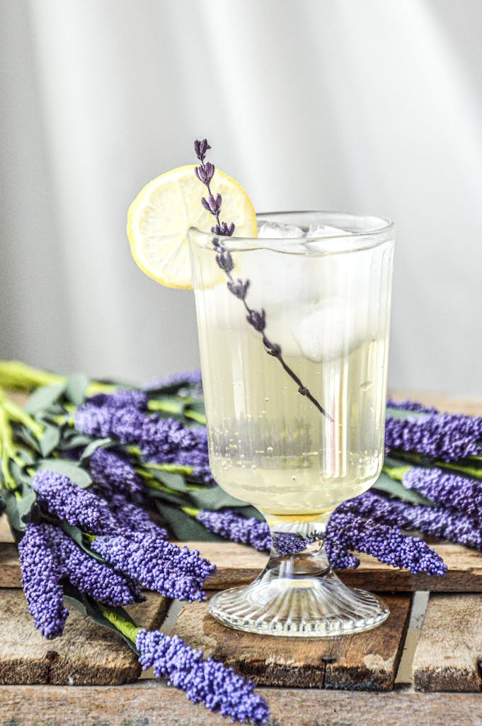Chilled lemonade with a lavender sprig, perfect for a refreshing summer drink.